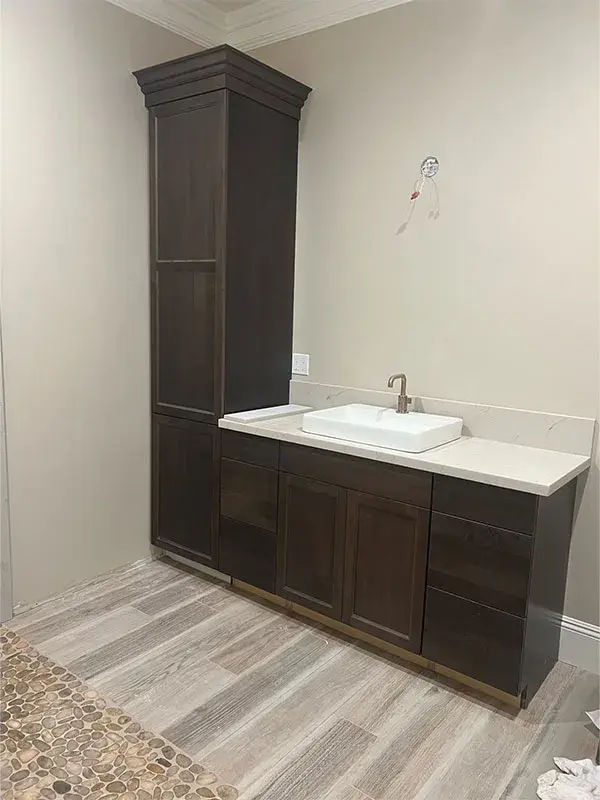 Bathroom project by Barron's Flooring & Home in Jackson, CA featuring Canyon Creek Alder stained vanity cabinets, Quartzite countertop, Surface Art Wood-look tile planks