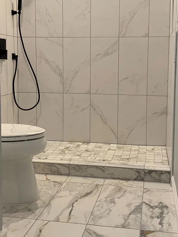 Bathroom project by Barron's Flooring & Home in Camanche, CA featuring 12×24 marble-look porcelain tile, 2×2 mosaic porcelain tile, 12×24 marble-look porcelain tile