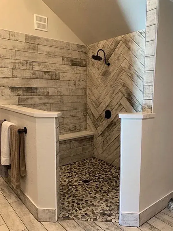 Bathroom project by Barron's Flooring & Home in Placerville, CA featuring Wood-look plank porcelain tile, Natural stone pebble mosaic, Wood-look plank porcelain tile