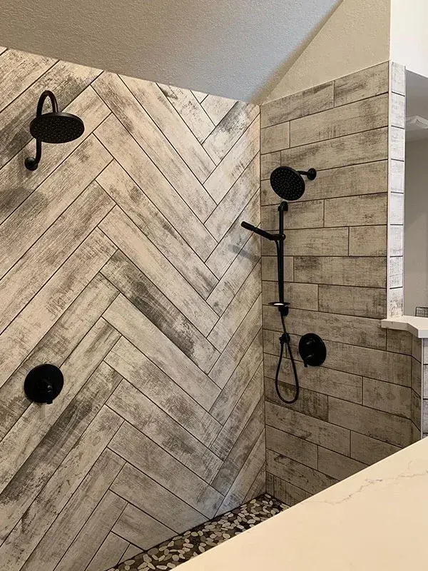 Bathroom project by Barron's Flooring & Home in Placerville, CA featuring Wood-look plank porcelain tile, Natural stone pebble mosaic, Wood-look plank porcelain tile