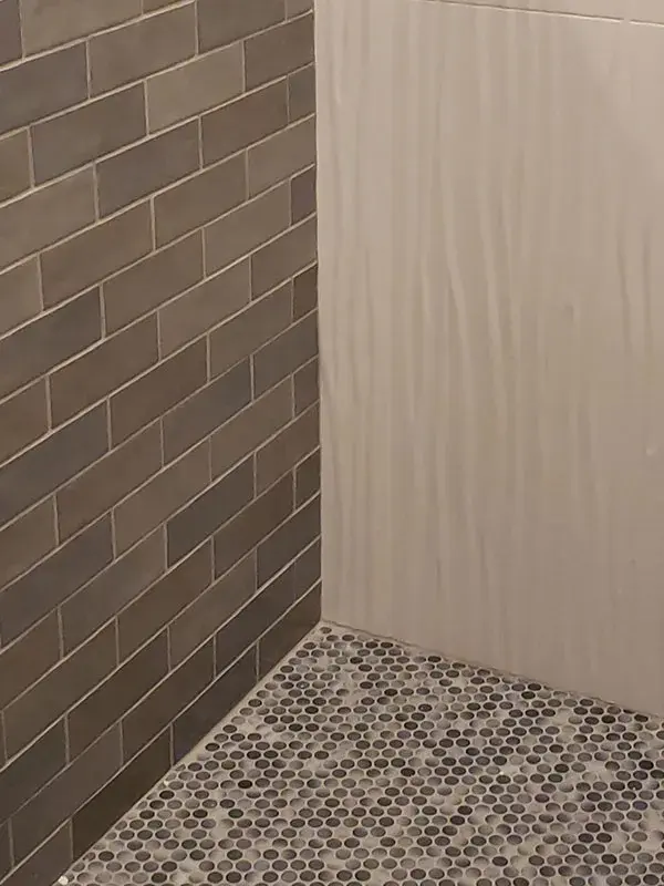 Bathroom project by Barron's Flooring & Home in Ione, CA featuring Subway tile, 3-D sculpted porcelain tile, Penny round mosaic tile