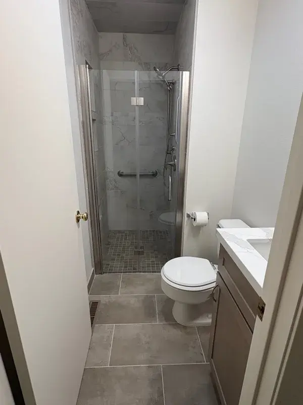 Bathroom project by Barron's Flooring & Home in Jackson, CA featuring Surface Art Touchstone 12×24 grey lappato tile, Surface Art Gallant 2×2 noce matte tile, Surface Art Touchstone 2×4 brick grey lappato tile