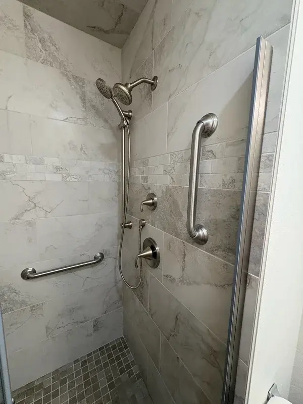 Bathroom project by Barron's Flooring & Home in Jackson, CA featuring Surface Art Touchstone 12×24 grey lappato tile, Surface Art Gallant 2×2 noce matte tile, Surface Art Touchstone 2×4 brick grey lappato tile