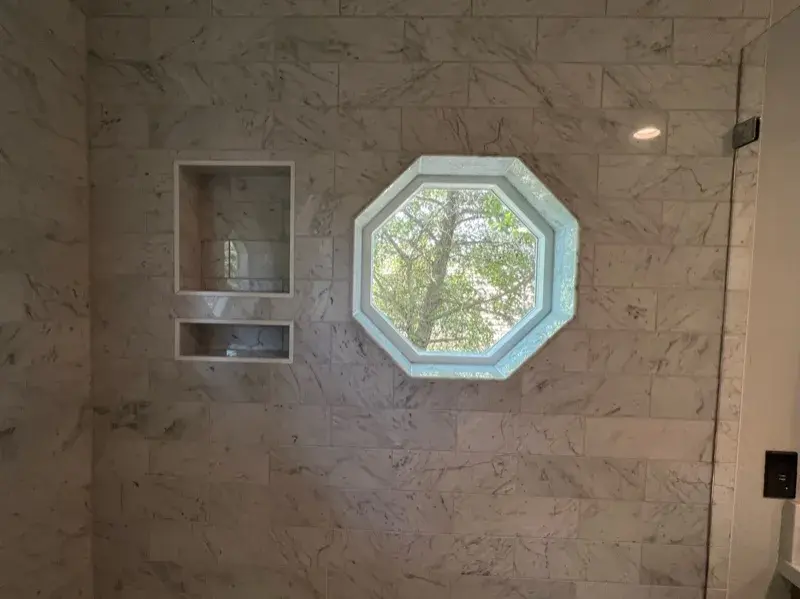Bathroom project by Barron's Flooring & Home in Valley Springs, CA featuring Carrara polished marble subway tile, Bianco Carrara/Nero dot polished mosaic, Bianco Carrara/Nero dot polished mosaic