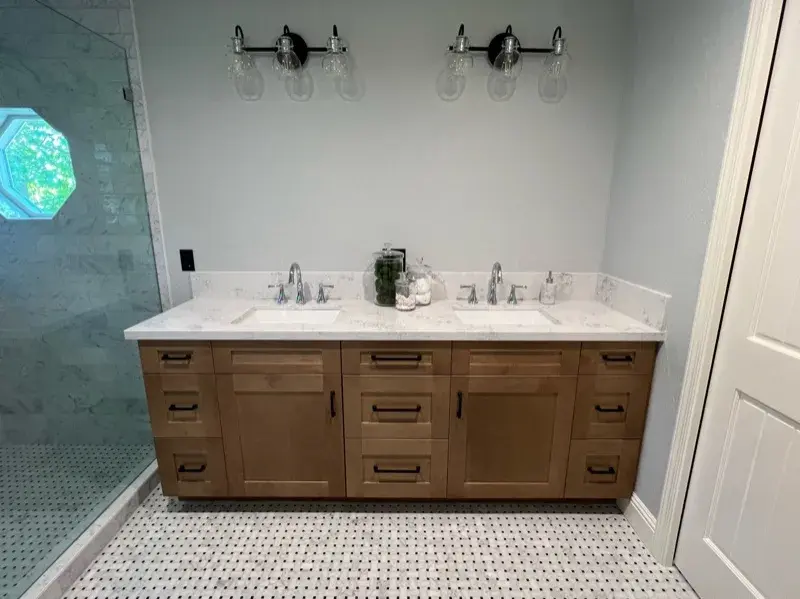 Bathroom project by Barron's Flooring & Home in Valley Springs, CA featuring Carrara polished marble subway tile, Bianco Carrara/Nero dot polished mosaic, Bianco Carrara/Nero dot polished mosaic