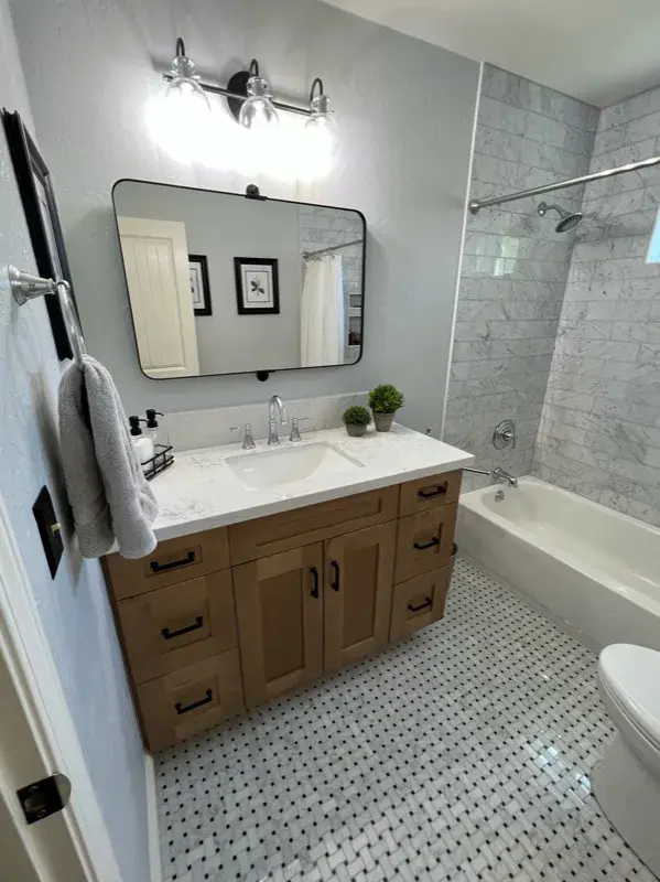 Bathroom project by Barron's Flooring & Home in Valley Springs, CA featuring Carrara polished marble subway tile, Bianco Carrara/Nero dot polished mosaic, Bianco Carrara/Nero dot polished mosaic