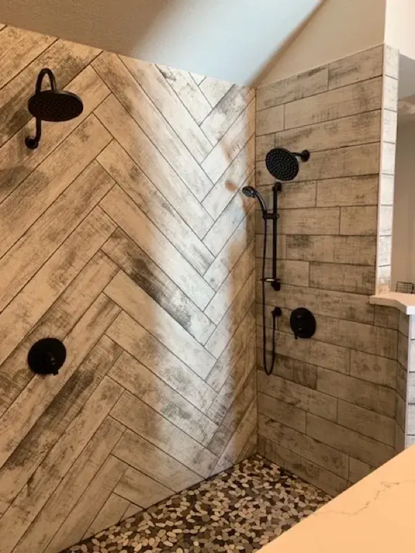 Bathroom project by Barron's Flooring & Home in Placerville, CA featuring Surface Art Oxidized Plank tile, Weathered Light, Maniscalco Botany Bay sliced pebble, Shadow Blend, Surface Art Oxidized Plank tile, Weathered Light