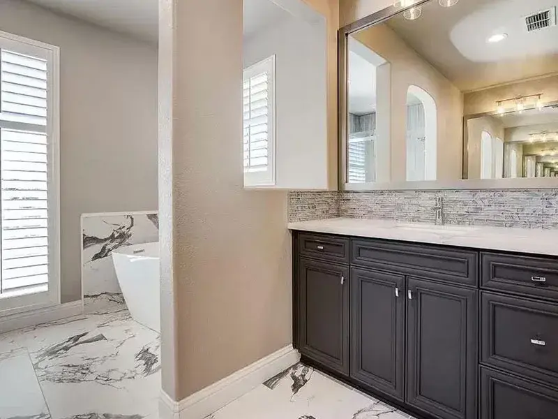 Bathroom project by Barron's Flooring & Home in El Dorado Hills, CA featuring Quartz countertop, Glass mosaic tile, Porcelain tile