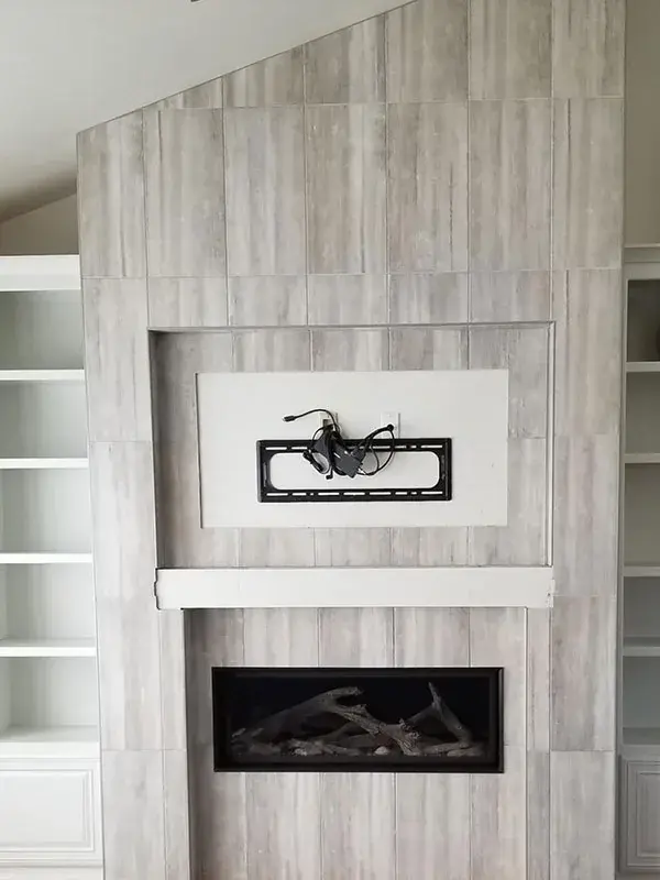 Fireplace project by Barron's Flooring & Home in the California foothills featuring 12×24 porcelain tile