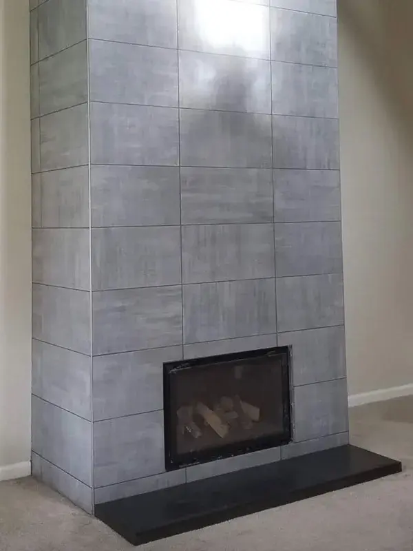 Fireplace project by Barron's Flooring & Home in the California foothills featuring 12×24 porcelain tile