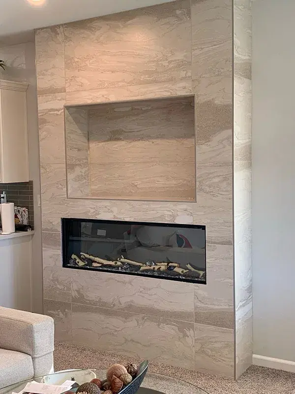 Fireplace project by Barron's Flooring & Home in the California foothills featuring 12×24 porcelain tile