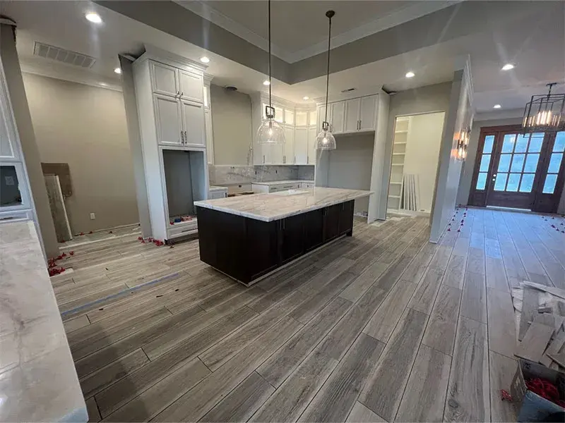 Kitchen project by Barron's Flooring & Home in Jackson, CA featuring Canyon Creek Maple painted cabinets, Quartzite countertop, Surface Art Subway tile