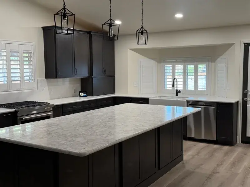 Kitchen project by Barron's Flooring & Home in Ione, CA featuring Kemper Maple cabinets, Marimac door, Colt stain, MSI Calacatta Ocellio 2cm quartz, MSI Calacatta Izaro 2cm quartz
