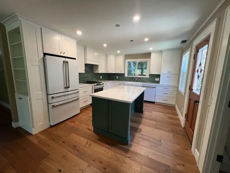 Kitchen project by Barron's Flooring & Home in Sutter Creek, CA featuring Kemper Maple cabinets painted White, Kemper Maple cabinets painted Retreat, Silestone Ethereal Glow 2cm quartz