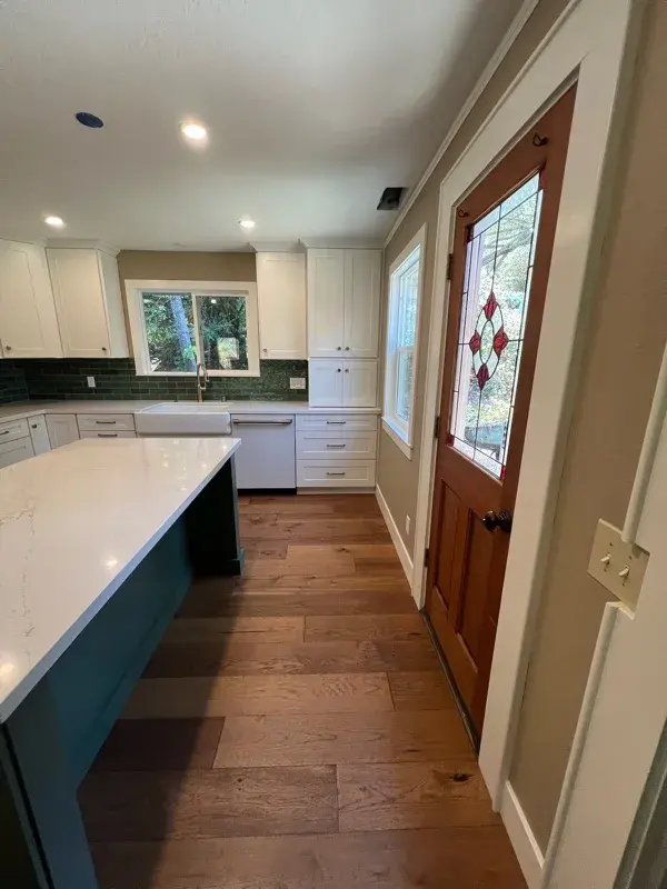 Kitchen project by Barron's Flooring & Home in Sutter Creek, CA featuring Kemper Maple cabinets painted White, Kemper Maple cabinets painted Retreat, Silestone Ethereal Glow 2cm quartz