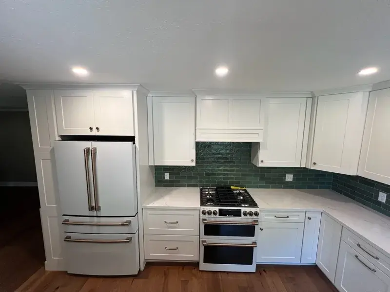 Kitchen project by Barron's Flooring & Home in Sutter Creek, CA featuring Kemper Maple cabinets painted White, Kemper Maple cabinets painted Retreat, Silestone Ethereal Glow 2cm quartz
