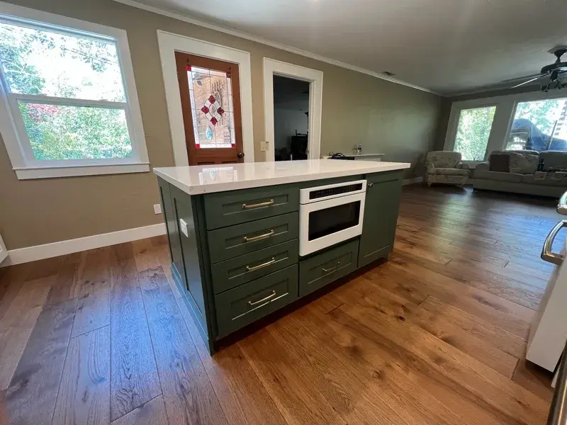 Kitchen project by Barron's Flooring & Home in Sutter Creek, CA featuring Kemper Maple cabinets painted White, Kemper Maple cabinets painted Retreat, Silestone Ethereal Glow 2cm quartz