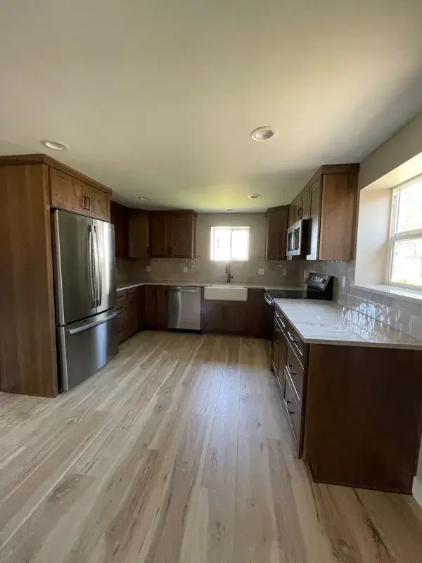 Kitchen project by Barron's Flooring & Home in Plymouth, CA featuring Kemper Rustic hickory cabinets, Marimac door, Kanga stain, Sensa Dakar 2cm quartzite, MSI Renzo square tile, Dove