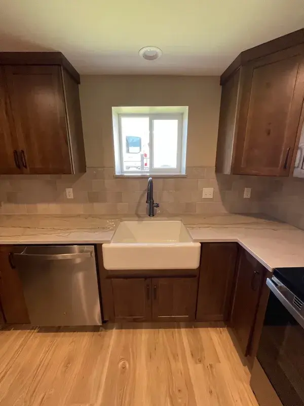 Kitchen project by Barron's Flooring & Home in Plymouth, CA featuring Kemper Rustic hickory cabinets, Marimac door, Kanga stain, Sensa Dakar 2cm quartzite, MSI Renzo square tile, Dove