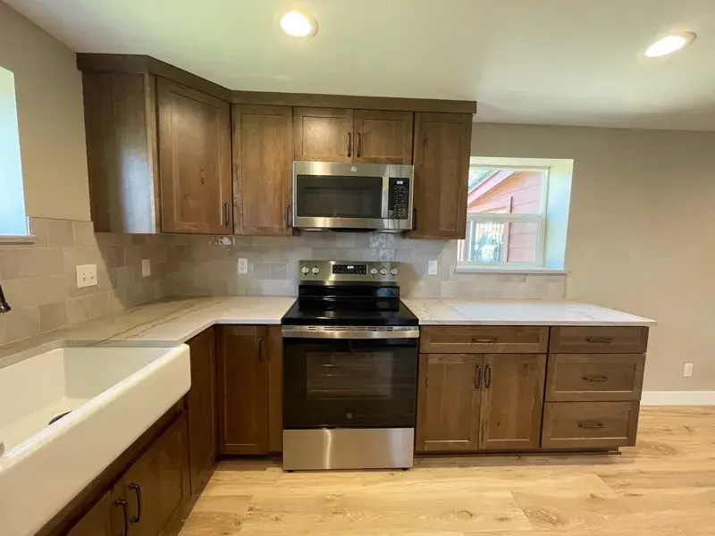 Kitchen project by Barron's Flooring & Home in Plymouth, CA featuring Kemper Rustic hickory cabinets, Marimac door, Kanga stain, Sensa Dakar 2cm quartzite, MSI Renzo square tile, Dove