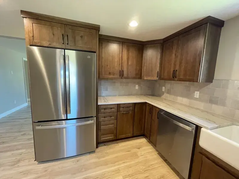 Kitchen project by Barron's Flooring & Home in Plymouth, CA featuring Kemper Rustic hickory cabinets, Marimac door, Kanga stain, Sensa Dakar 2cm quartzite, MSI Renzo square tile, Dove