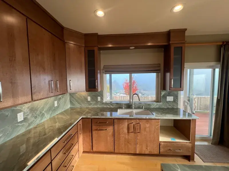 Kitchen project by Barron's Flooring & Home in Jackson, CA featuring Canyon Creek Maple cabinets, Copenhagen door, Chickory stain, Cosentino Itara 3cm quartzite, White quartz composite 33" double-basin sink