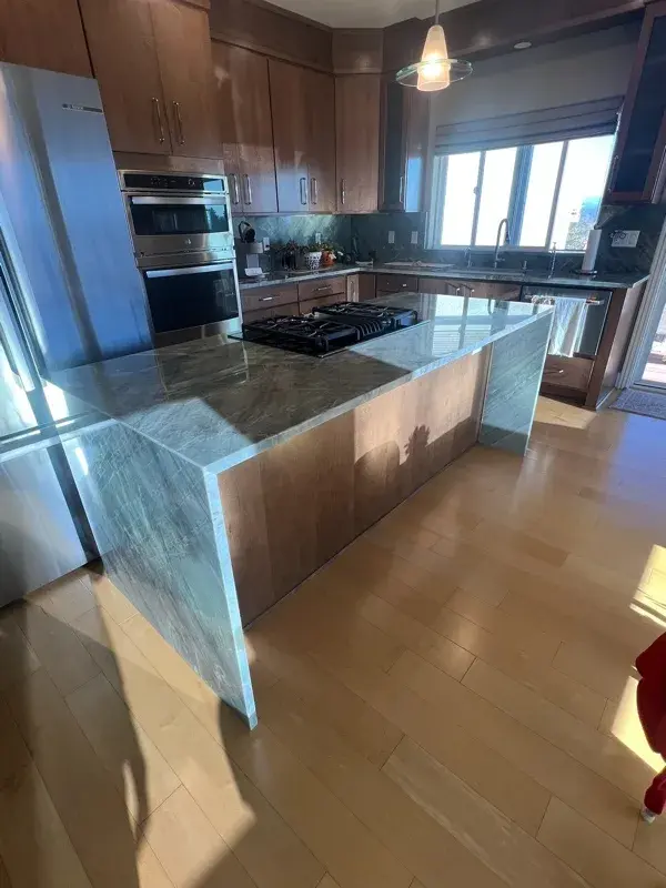 Kitchen project by Barron's Flooring & Home in Jackson, CA featuring Canyon Creek Maple cabinets, Copenhagen door, Chickory stain, Cosentino Itara 3cm quartzite, White quartz composite 33" double-basin sink
