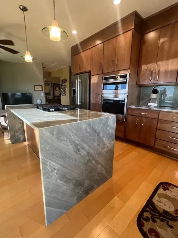 Kitchen project by Barron's Flooring & Home in Jackson, CA featuring Canyon Creek Maple cabinets, Copenhagen door, Chickory stain, Cosentino Itara 3cm quartzite, White quartz composite 33" double-basin sink