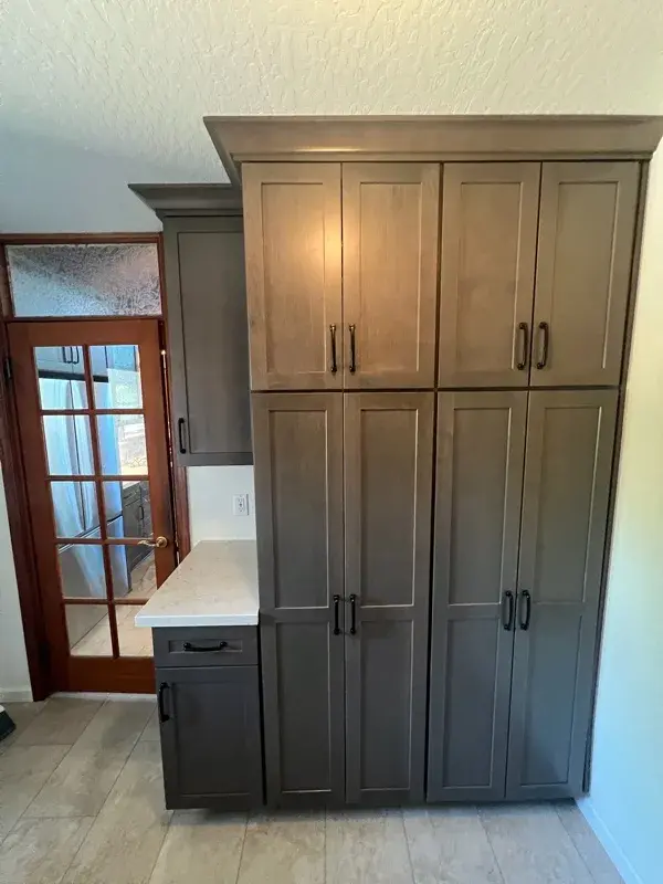 Kitchen project by Barron's Flooring & Home in Sutter Creek, CA featuring Kemper Maple cabinets, Marimac door, Colt stain, MSI Cashmere Taj 2cm quartz, Surface Art Parkside subway tile, beige, 2.5×8