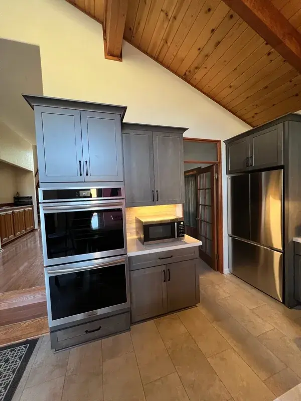 Kitchen project by Barron's Flooring & Home in Sutter Creek, CA featuring Kemper Maple cabinets, Marimac door, Colt stain, MSI Cashmere Taj 2cm quartz, Surface Art Parkside subway tile, beige, 2.5×8