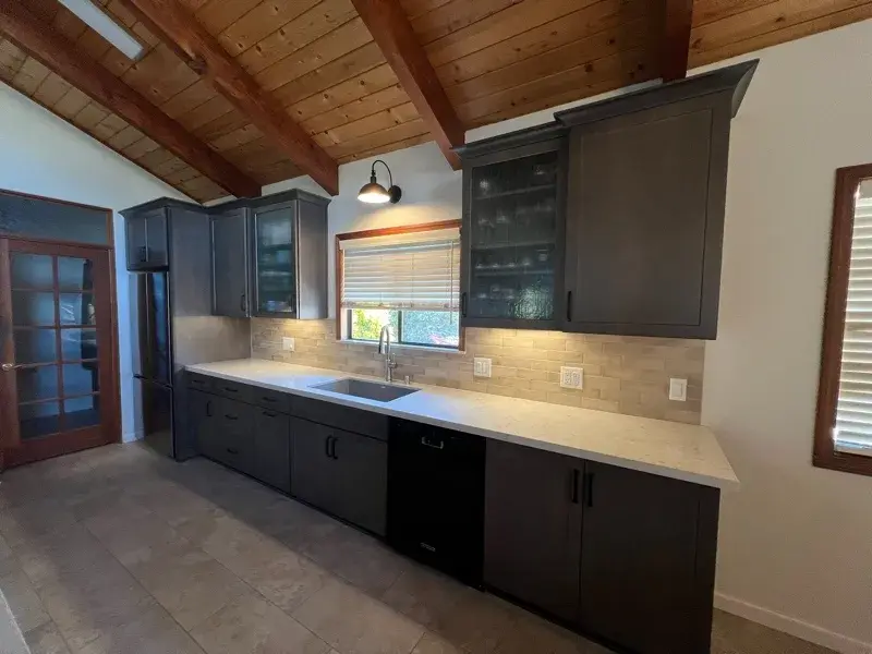 Kitchen project by Barron's Flooring & Home in Sutter Creek, CA featuring Kemper Maple cabinets, Marimac door, Colt stain, MSI Cashmere Taj 2cm quartz, Surface Art Parkside subway tile, beige, 2.5×8