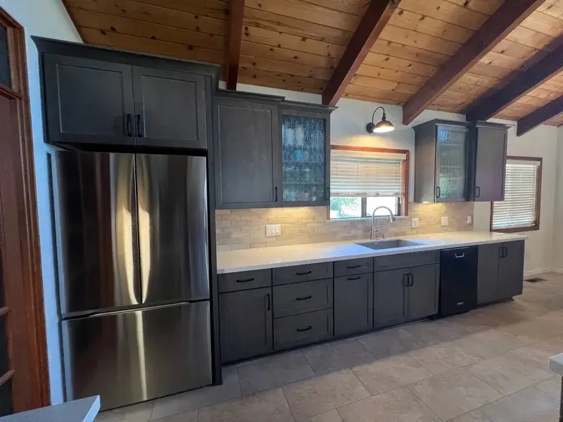 Kitchen project by Barron's Flooring & Home in Sutter Creek, CA featuring Kemper Maple cabinets, Marimac door, Colt stain, MSI Cashmere Taj 2cm quartz, Surface Art Parkside subway tile, beige, 2.5×8