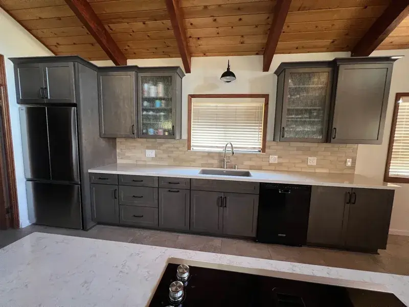 Kitchen project by Barron's Flooring & Home in Sutter Creek, CA featuring Kemper Maple cabinets, Marimac door, Colt stain, MSI Cashmere Taj 2cm quartz, Surface Art Parkside subway tile, beige, 2.5×8