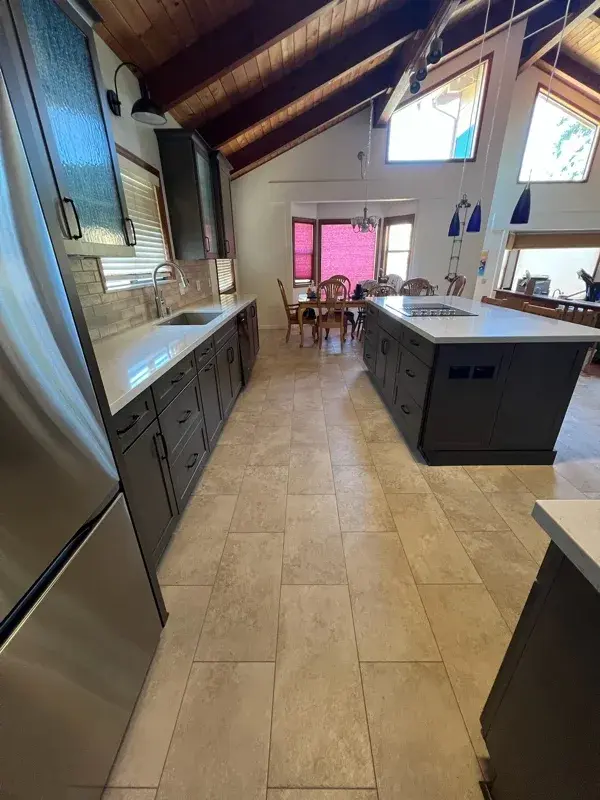 Kitchen project by Barron's Flooring & Home in Sutter Creek, CA featuring Kemper Maple cabinets, Marimac door, Colt stain, MSI Cashmere Taj 2cm quartz, Surface Art Parkside subway tile, beige, 2.5×8