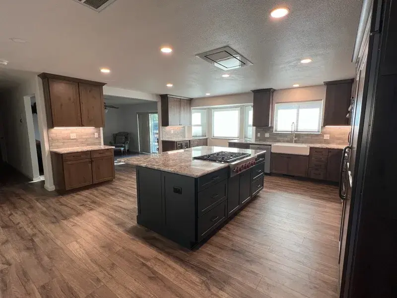 Kitchen project by Barron's Flooring & Home in Plymouth, CA featuring Kemper Rustic alder cabinets, Marric door, Morel stain, Kemper Maple cabinets, Marric door, painted Maritime, MSI Avalon White 2cm granite