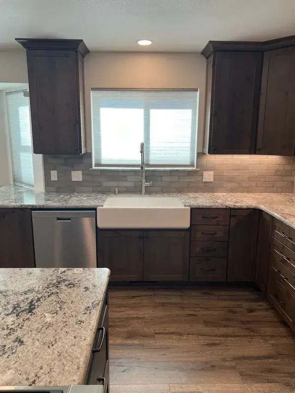 Kitchen project by Barron's Flooring & Home in Plymouth, CA featuring Kemper Rustic alder cabinets, Marric door, Morel stain, Kemper Maple cabinets, Marric door, painted Maritime, MSI Avalon White 2cm granite
