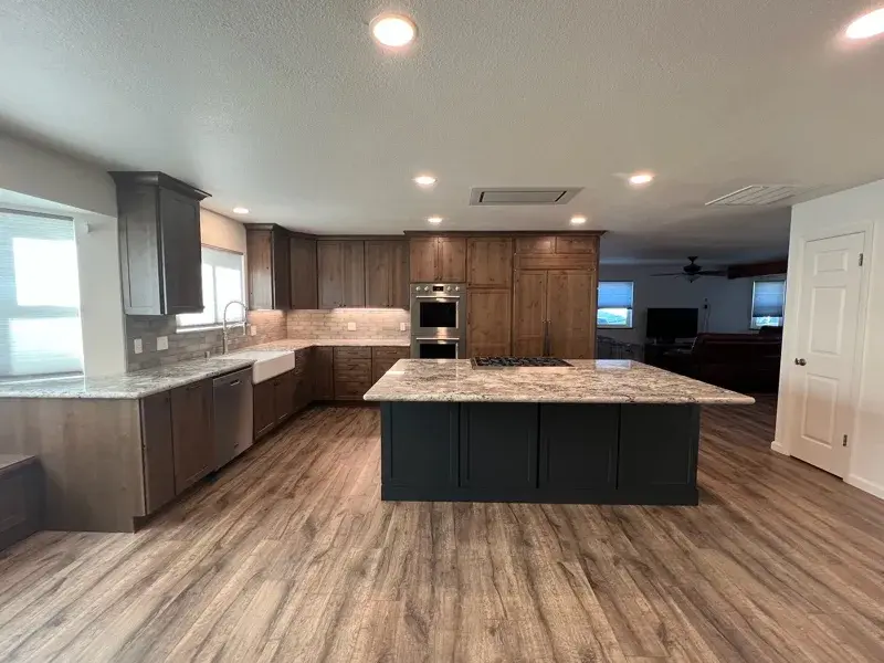Kitchen project by Barron's Flooring & Home in Plymouth, CA featuring Kemper Rustic alder cabinets, Marric door, Morel stain, Kemper Maple cabinets, Marric door, painted Maritime, MSI Avalon White 2cm granite