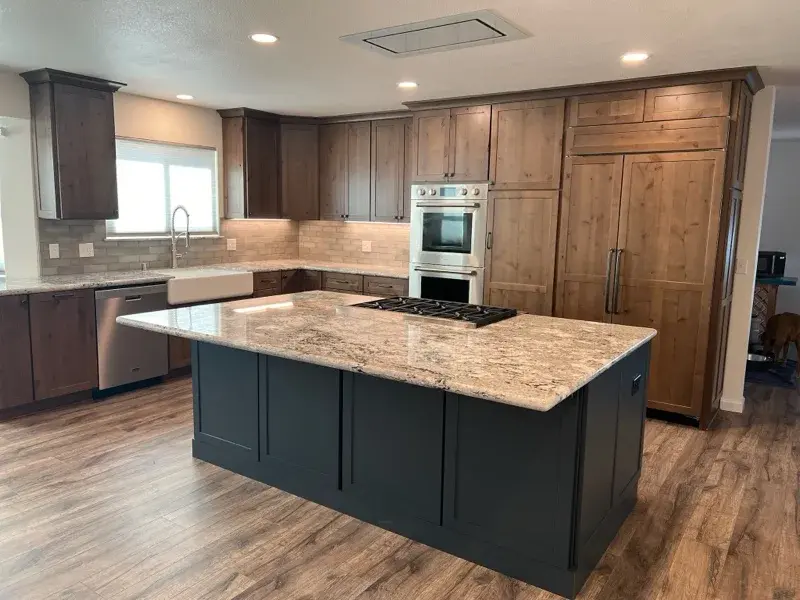 Kitchen project by Barron's Flooring & Home in Plymouth, CA featuring Kemper Rustic alder cabinets, Marric door, Morel stain, Kemper Maple cabinets, Marric door, painted Maritime, MSI Avalon White 2cm granite