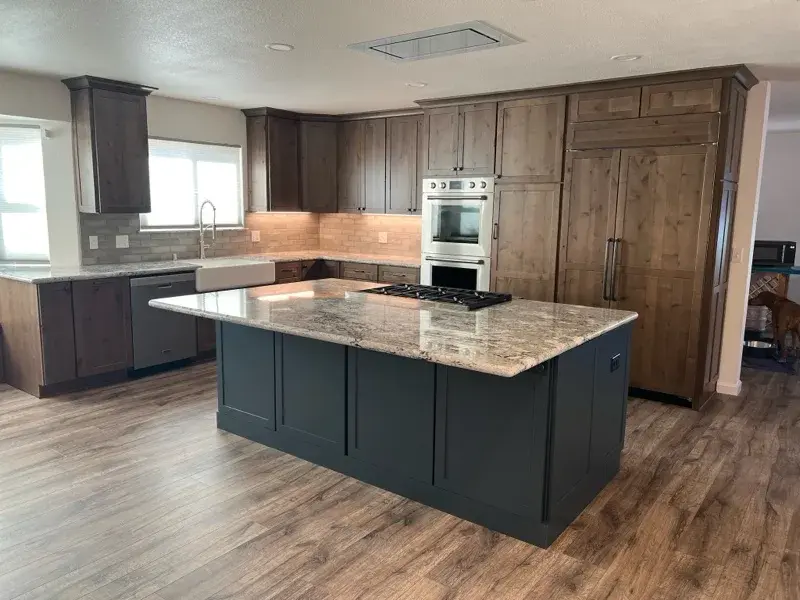 Kitchen project by Barron's Flooring & Home in Plymouth, CA featuring Kemper Rustic alder cabinets, Marric door, Morel stain, Kemper Maple cabinets, Marric door, painted Maritime, MSI Avalon White 2cm granite