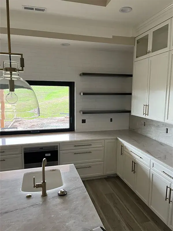 Kitchen project by Barron's Flooring & Home in Jackson, CA featuring Canyon Creek Maple painted cabinets, Quartzite countertop, Surface Art Subway tile