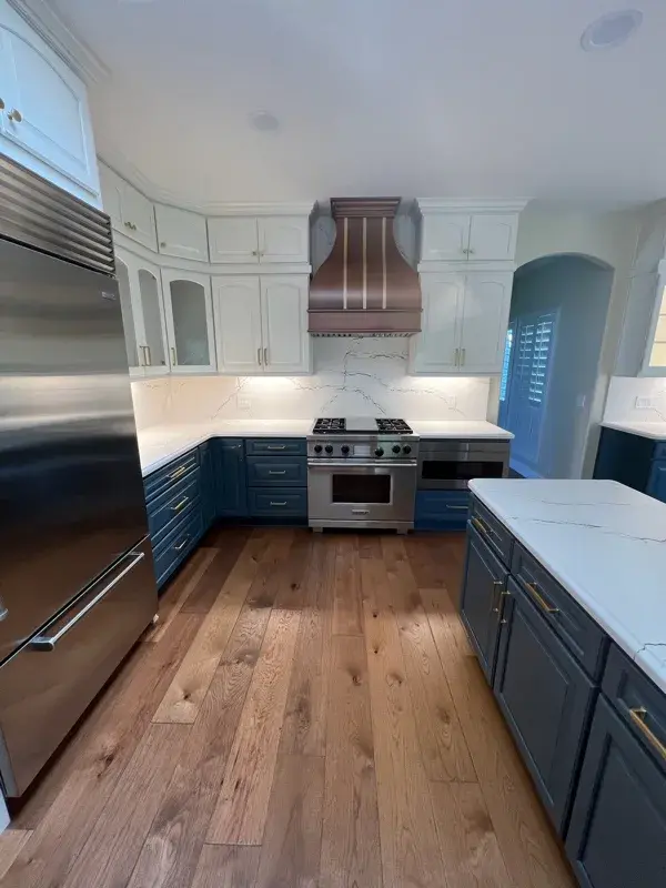 Kitchen project by Barron's Flooring & Home in Loomis, CA featuring Canyon Creek Maple cabinets painted Snow Cap, Canyon Creek Maple cabinets painted Breeze, Cambria Berkshire Brass Satin Ridge 2cm quartz
