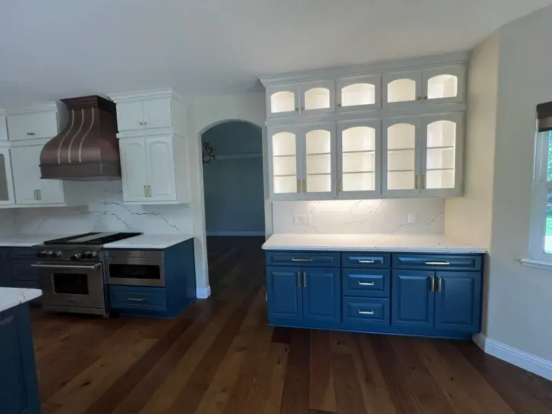 Kitchen project by Barron's Flooring & Home in Loomis, CA featuring Canyon Creek Maple cabinets painted Snow Cap, Canyon Creek Maple cabinets painted Breeze, Cambria Berkshire Brass Satin Ridge 2cm quartz