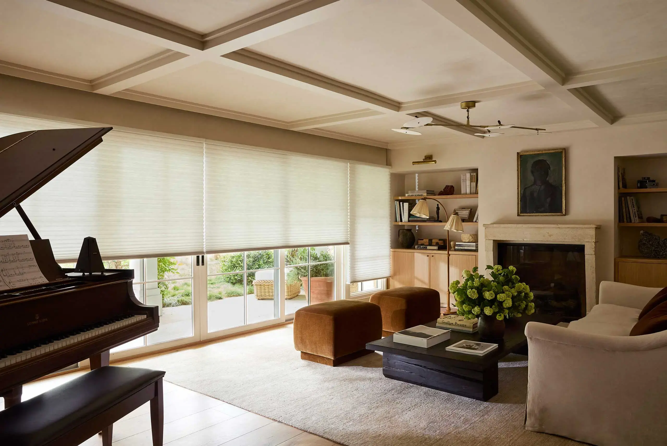 Living room with floor-to-ceiling cellular shades filtering soft natural light
